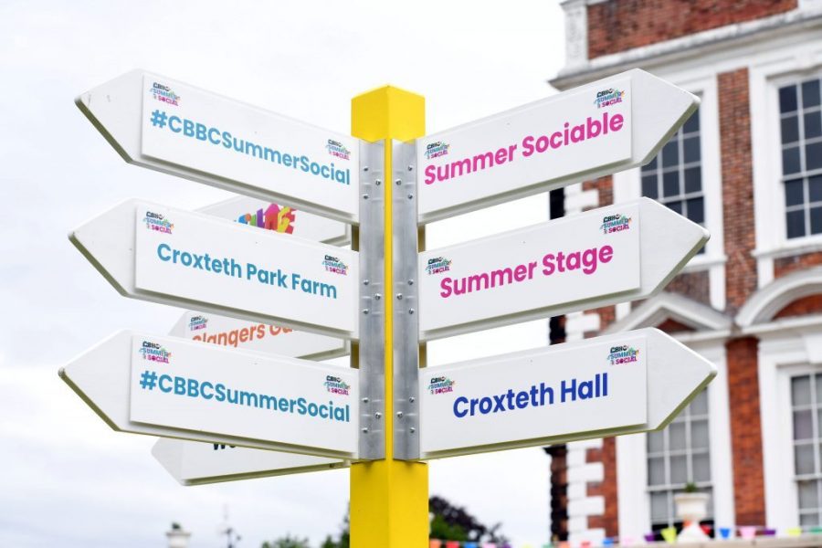 direction sign for the different stages at croxeth park festival BBC summer social